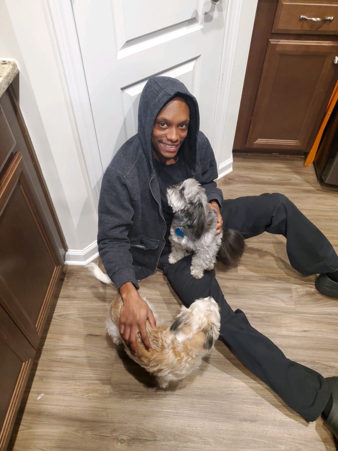 Regal Rovers caregiver spending attentive one-on-one time with companion dogs